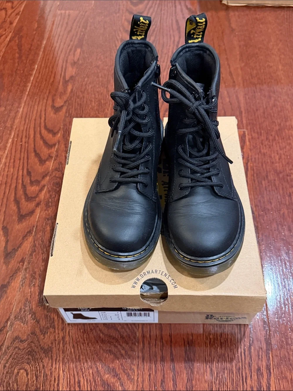Dr. Martens Black Leather 8-Eye Lace-Up Boot with Yellow Heel Loop